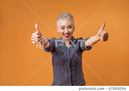 Portrait of young girl with blond short hairstyle 67809264