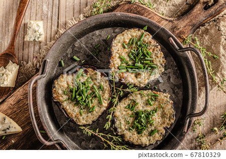 Delicious eggplant baked with cheese Delicious eggplant baked with cheese 67810329