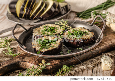 Delicious eggplant baked with cheese Delicious eggplant baked with cheese 67810340