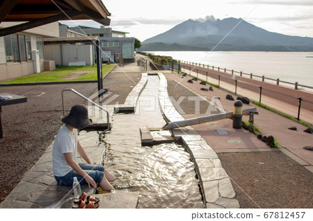 A woman in a long footbath at Yusurikan, a roadside station in Tarumi City, Kagoshima Prefecture. A woman in a long footbath at Yusurikan, a roadside station in Tarumi City, Kagoshima Prefecture. 67812457
