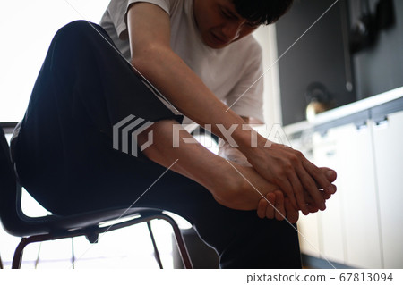 Men suffering from leg pain Men suffering from leg pain 67813094