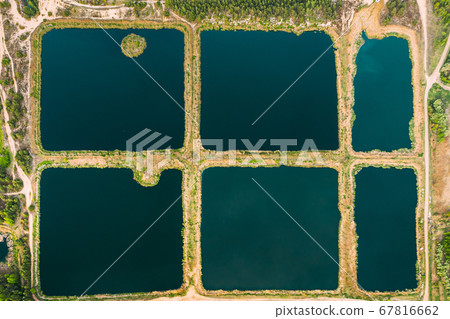 Aerial View Retention Basins, Wet Pond, Wet Detention Basin Or Stormwater Management Pond, Is An Artificial Pond With Vegetation Around The Perimeter, And Includes A Permanent Pool Of Water In Its 67816662
