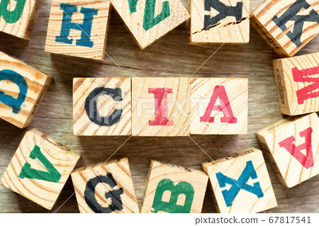 Alphabet letter block in word CIA (abbreviation of certified internal auditor) with another on wood background 67817541