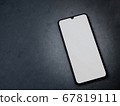 Black mobile smartphone mockup lies on the surface 67819111