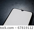 Black mobile smartphone mockup lies on the surface 67819112