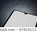 Black mobile smartphone mockup lies on the surface 67819113