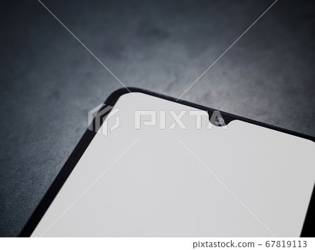 Black mobile smartphone mockup lies on the surface 67819113