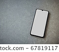 Black mobile smartphone mockup lies on the surface 67819117