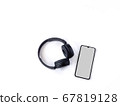 Black wireless headphone and mobile smartphone 67819128