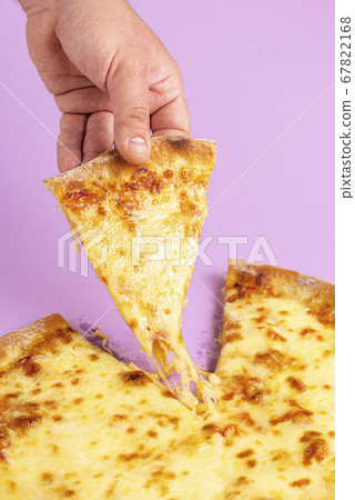 Cheese pizza close-up. Grabbing a slice of pizza 67822168