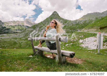wind in hair woman relax at countryside with beautiful view 67824097