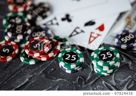 Poker cards and stacks of poker chips on a grey background. Poker online concept 67824438