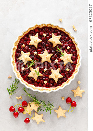 Homemade cherry pie, tart with star shaped cookies Homemade cherry pie, tart with star shaped cookies 67825037