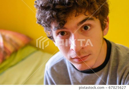 Portrait of a brown curly haired caucasian boy 67825627