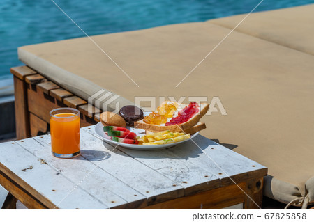 Healthy breakfast with fruit and sandwich at the resort Healthy breakfast with fruit and sandwich at the resort 67825858
