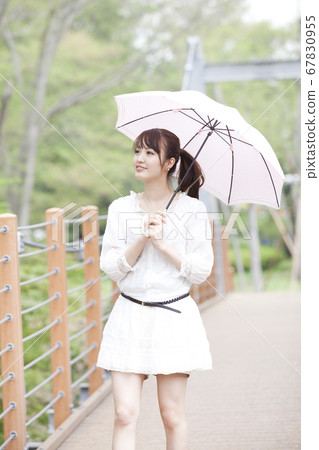 Woman with a parasol Woman with a parasol 67830955