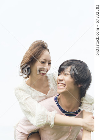 Girlfriend hugging her boyfriend Girlfriend hugging her boyfriend 67832383