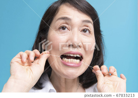 Middle woman doing a toothpick Middle woman doing a toothpick 67833213