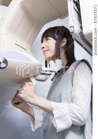 A woman taking an X-ray 67835871