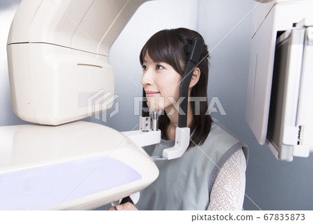 A woman taking an X-ray A woman taking an X-ray 67835873