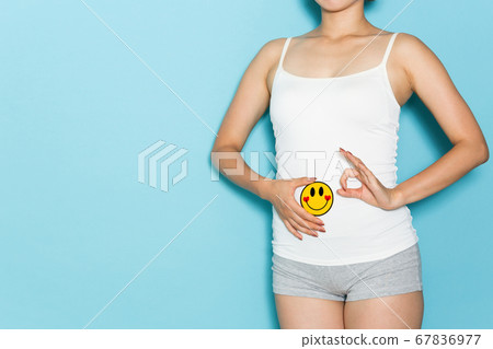 Woman with smile on stomach 67836977