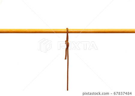 Rope tied around a wooden log Rope tied around a wooden log 67837484