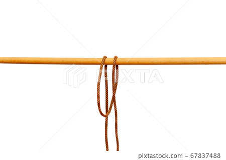 Rope tied around a wooden log Rope tied around a wooden log 67837488