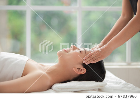A woman relaxing with beauty treatment A woman relaxing with beauty treatment 67837966