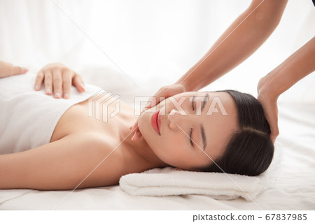A woman relaxing with beauty treatment A woman relaxing with beauty treatment 67837985