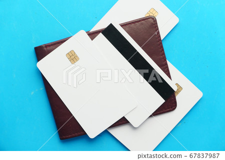 close up of credit cards on wallet on blue background close up of credit cards on wallet on blue background 67837987