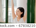 Woman stretching in her room 67838210