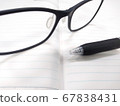 Glasses and ballpoint pen 67838431