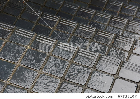 Tiled stairs wet and slippery in the rain Tiled stairs wet and slippery in the rain 67839107