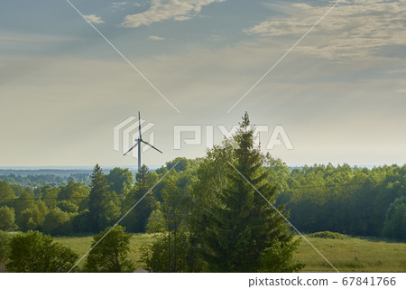 Wind turbine in the field. Wind power energy 67841766
