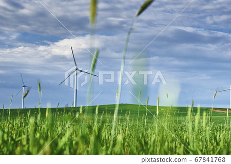 Wind turbine in the field. Wind power energy 67841768