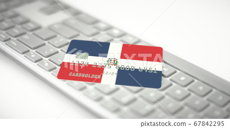 Plastic bank card depicting flag of the Dominican Republic on computer keyboard. Fictional numbers Plastic bank card depicting flag of the Dominican Republic on computer keyboard. Fictional numbers 67842295