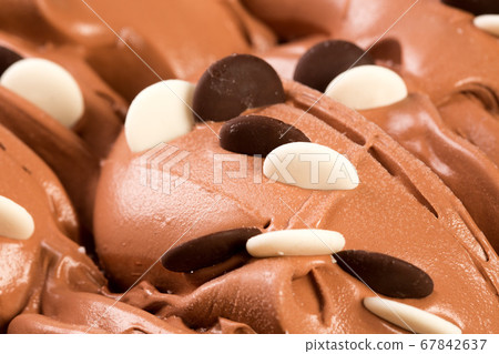 Chocolate cream with sweets. 67842637