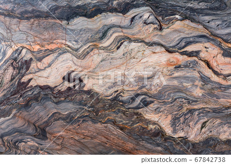 Brown stone or rock background and texture, macro shot. 67842738