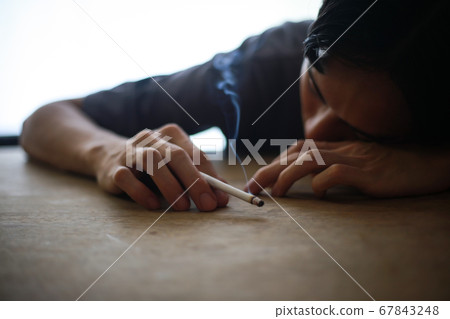 Image of sleeping cigarette Image of sleeping cigarette 67843248