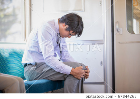 A man riding a train 67844265