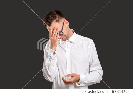 disappointed man portrait facepalm gesture skeptic 67844294