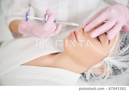 Aesthetic facial treatment provided by cosmetic master Aesthetic facial treatment provided by cosmetic master 67845382