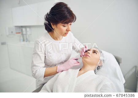 Professional injection cosmetology performed by beauty specialist Professional injection cosmetology performed by beauty specialist 67845386