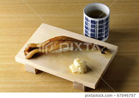 A handful of conger eel and tea on sushi geta A handful of conger eel and tea on sushi geta 67846787