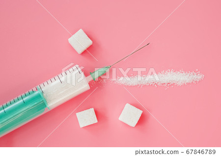 Syringe with granulated sugar inside. 67846789