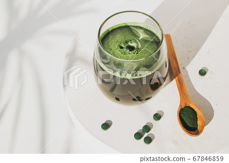 Spirulina or chlorella. Green food supplement. 67846859