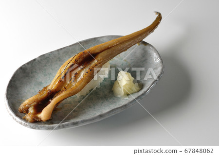 A handful of grilled conger eel served on a plate (white background) A handful of grilled conger eel served on a plate (white background) 67848062