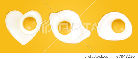 Fried eggs in heart shape top view Fried eggs in heart shape top view 67848230