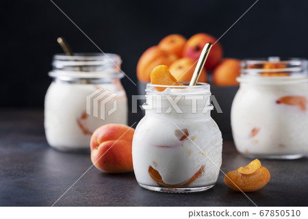 Sweet healthy yogurt with apricots Sweet healthy yogurt with apricots 67850510