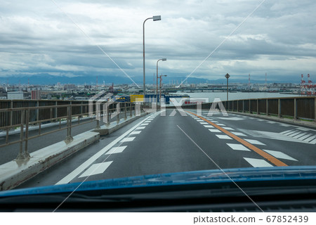 Highway scenery from a car heading to Nanko, Osaka Highway scenery from a car heading to Nanko, Osaka 67852439